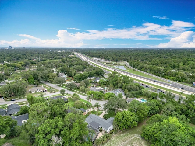 148 Tarrytown Trl, Longwood, FL 32750 - drone / aerial view of a heavily wooded area and a highway
