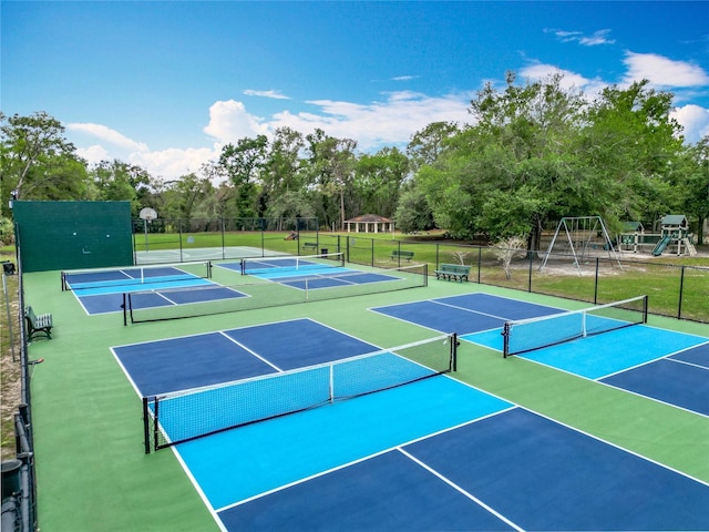 148 Tarrytown Trl, Longwood, FL 32750 - view of tennis court with fence, view of scattered trees, and community basketball court