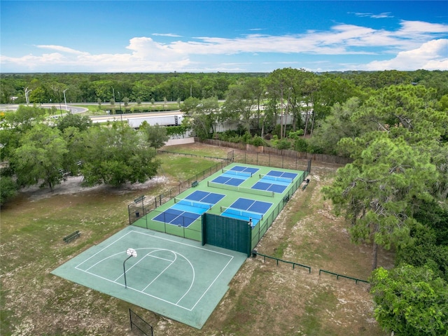 148 Tarrytown Trl, Longwood, FL 32750 - view of sport court featuring a tennis court, fence, and a wooded view
