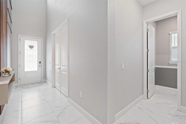 9845 Emerald Berry Dr, Winter Garden, FL 34787 - entrance foyer featuring light marble finish floors and baseboards
