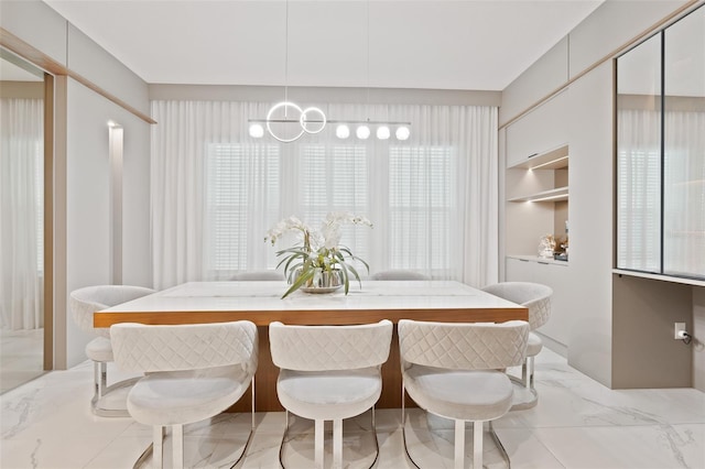 9845 Emerald Berry Dr, Winter Garden, FL 34787 - dining space featuring light marble finish flooring