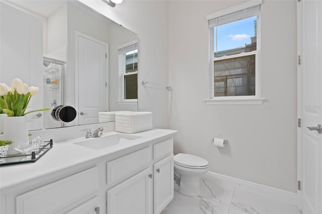 9845 Emerald Berry Dr, Winter Garden, FL 34787 - full bath featuring marble finish flooring, vanity, baseboards, toilet, and a shower with shower door