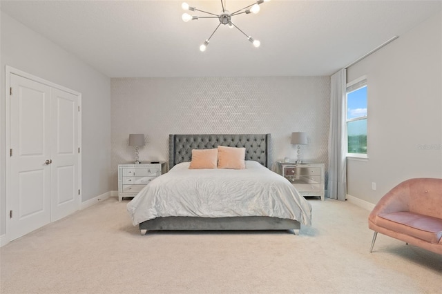 9845 Emerald Berry Dr, Winter Garden, FL 34787 - bedroom with a chandelier, carpet floors, an accent wall, and baseboards