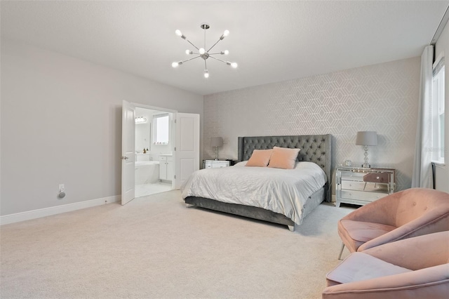 9845 Emerald Berry Dr, Winter Garden, FL 34787 - carpeted bedroom with a chandelier, multiple windows, baseboards, and ensuite bathroom