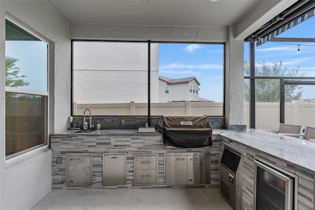 9845 Emerald Berry Dr, Winter Garden, FL 34787 - sunroom / solarium with beverage cooler and a sink