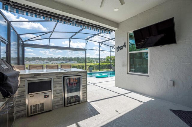 9845 Emerald Berry Dr, Winter Garden, FL 34787 - view of patio with wine cooler, an outdoor kitchen, a ceiling fan, an outdoor pool, and glass enclosure