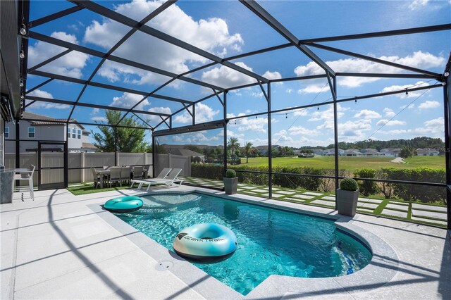 9845 Emerald Berry Dr, Winter Garden, FL 34787 - view of swimming pool with a patio area, glass enclosure, and outdoor dining space
