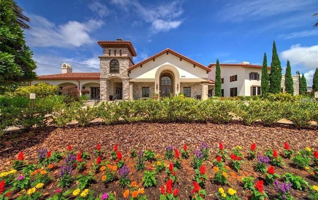9845 Emerald Berry Dr, Winter Garden, FL 34787 - view of front of house featuring stucco siding and a chimney