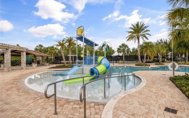 9845 Emerald Berry Dr, Winter Garden, FL 34787 - community pool featuring a water slide, a water play area, and a patio area