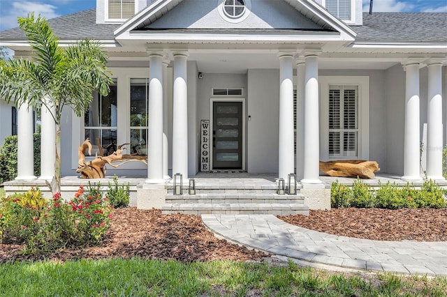 8430 Woburn Ct, Windermere, FL 34786 - property entrance featuring a porch and a shingled roof