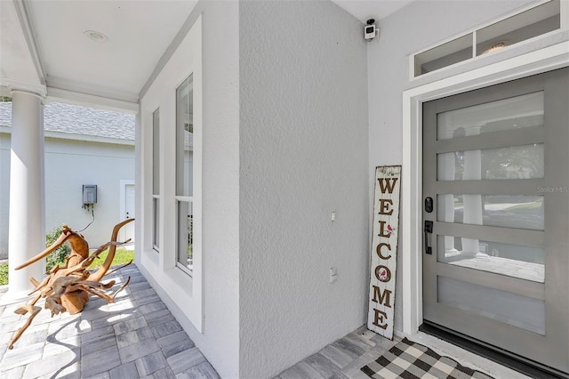 8430 Woburn Ct, Windermere, FL 34786 - entrance to property featuring stucco siding and a porch