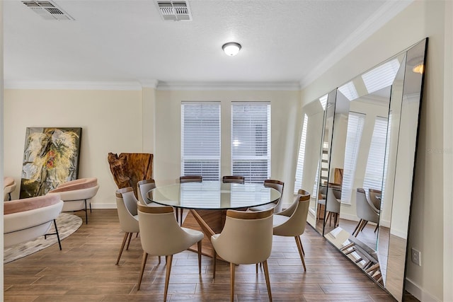 8430 Woburn Ct, Windermere, FL 34786 - dining space featuring ornamental molding, dark wood finished floors, and baseboards