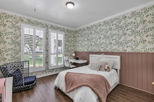 8430 Woburn Ct, Windermere, FL 34786 - bedroom with wallpapered walls, dark wood-type flooring, a wainscoted wall, and crown molding