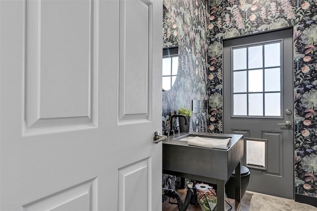 8430 Woburn Ct, Windermere, FL 34786 - bathroom featuring wallpapered walls, plenty of natural light, and vanity