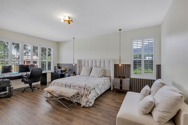 8430 Woburn Ct, Windermere, FL 34786 - bedroom featuring a desk, multiple windows, wood finished floors, and radiator
