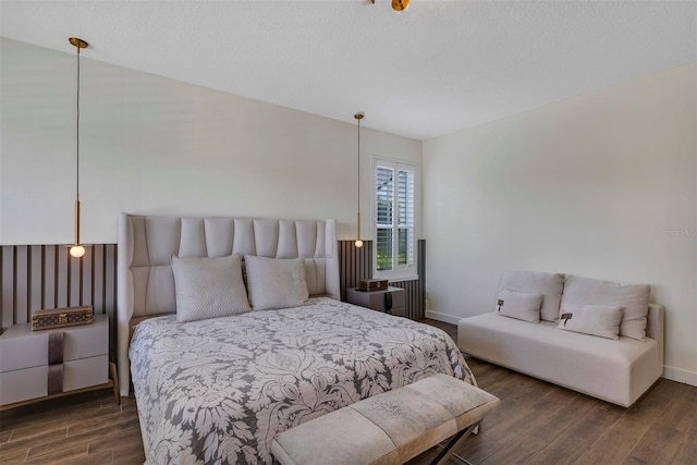 8430 Woburn Ct, Windermere, FL 34786 - bedroom featuring wood finished floors, baseboards, and a textured ceiling