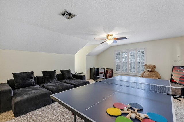 8430 Woburn Ct, Windermere, FL 34786 - game room with carpet flooring, ceiling fan, lofted ceiling, and a textured ceiling