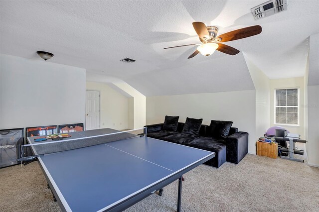 8430 Woburn Ct, Windermere, FL 34786 - playroom with carpet flooring, ceiling fan, vaulted ceiling, and a textured ceiling