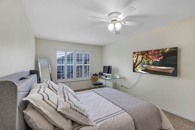 8430 Woburn Ct, Windermere, FL 34786 - carpeted bedroom with baseboards and ceiling fan