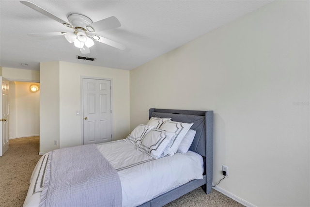 8430 Woburn Ct, Windermere, FL 34786 - bedroom with carpet, baseboards, and a ceiling fan