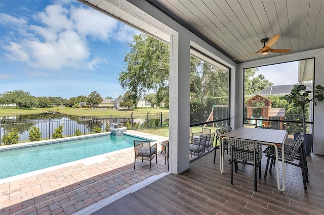 8430 Woburn Ct, Windermere, FL 34786 - sunroom / solarium featuring a water view, ceiling fan, outdoor dining space, and vaulted ceiling
