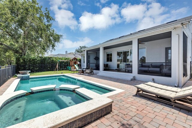 8430 Woburn Ct, Windermere, FL 34786 - view of swimming pool with a playground, a patio area, a fenced backyard, and a pool with connected hot tub