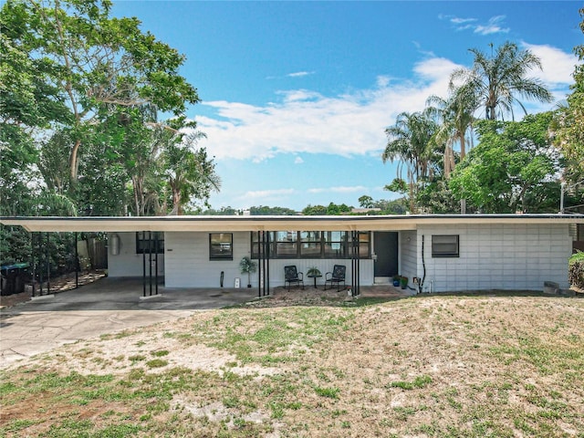 3788 N Econlockhatchee Trl, Orlando, FL 32817 - ranch-style home with an attached carport, a front lawn, and concrete driveway
