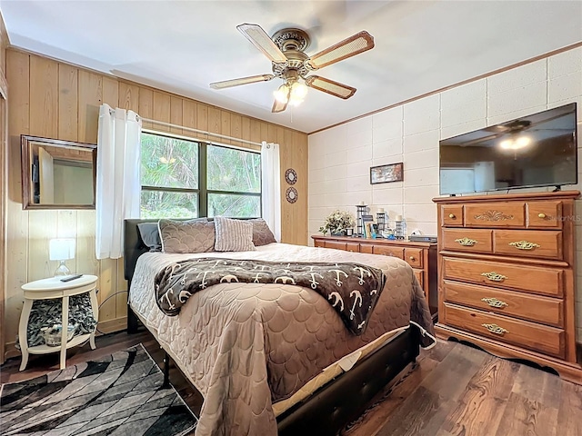 3788 N Econlockhatchee Trl, Orlando, FL 32817 - bedroom with wooden walls, dark wood-type flooring, ceiling fan, and crown molding