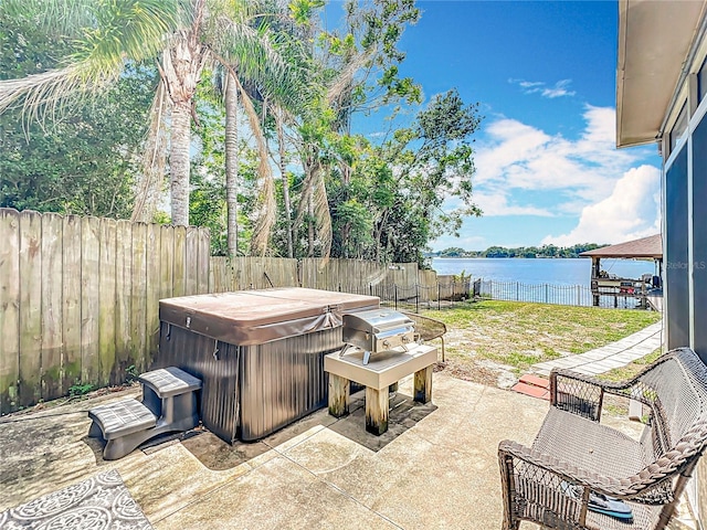 3788 N Econlockhatchee Trl, Orlando, FL 32817 - view of patio / terrace with a hot tub, a water view, a fenced backyard, and a gazebo