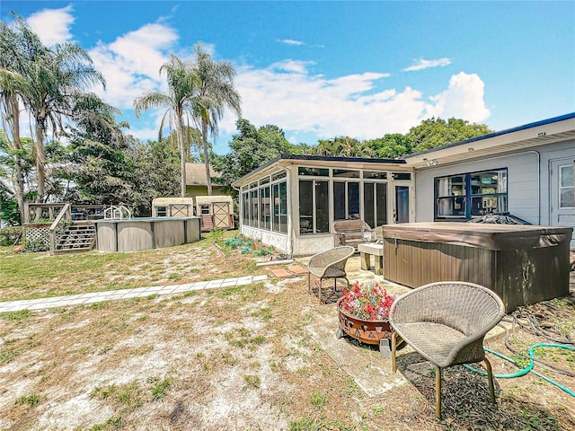3788 N Econlockhatchee Trl, Orlando, FL 32817 - view of yard with a hot tub, a sunroom, and an outdoor pool