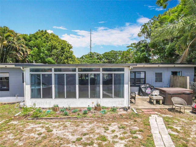 3788 N Econlockhatchee Trl, Orlando, FL 32817 - rear view of house featuring a hot tub and a patio area