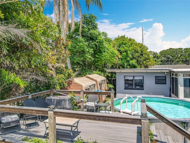 3788 N Econlockhatchee Trl, Orlando, FL 32817 - outdoor pool with a wooden deck and an outdoor structure