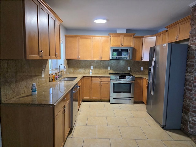 1695 E Horatio Ave, Maitland, FL 32751 - kitchen featuring stainless steel appliances, a sink, stone countertops, light tile patterned floors, and tasteful backsplash