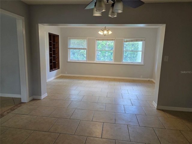 1695 E Horatio Ave, Maitland, FL 32751 - empty room with a chandelier, healthy amount of natural light, and baseboards