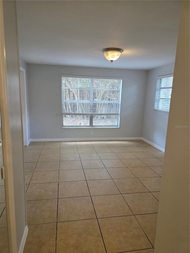 1695 E Horatio Ave, Maitland, FL 32751 - tiled empty room with baseboards