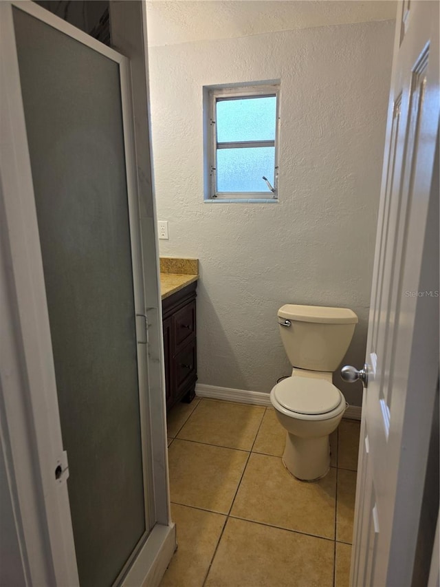 1695 E Horatio Ave, Maitland, FL 32751 - full bath with a stall shower, vanity, tile patterned floors, and toilet