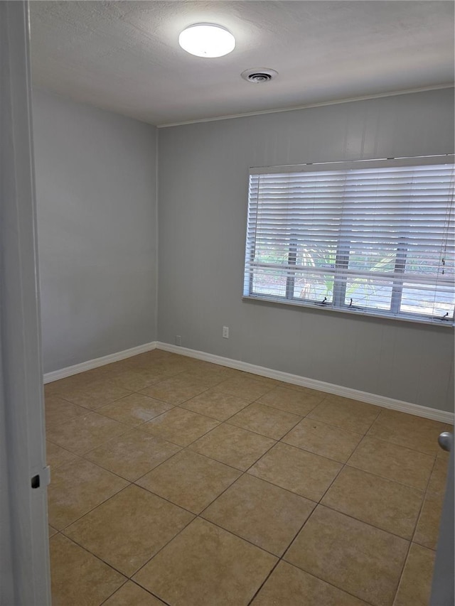 1695 E Horatio Ave, Maitland, FL 32751 - tiled empty room featuring baseboards and a textured ceiling
