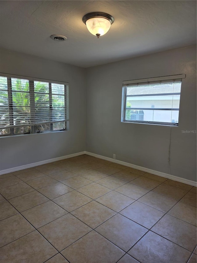 1695 E Horatio Ave, Maitland, FL 32751 - unfurnished room with light tile patterned floors and baseboards