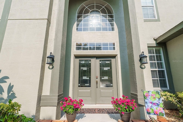 property entrance featuring french doors