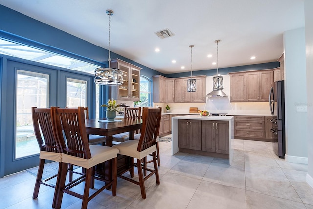 dining room with a chandelier, recessed lighting, and baseboards