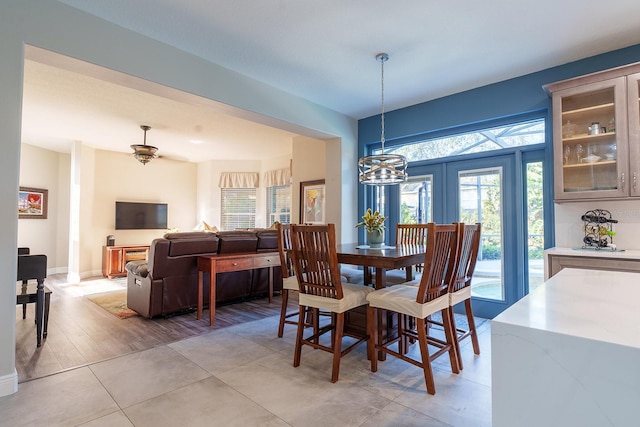 dining space with a chandelier and baseboards