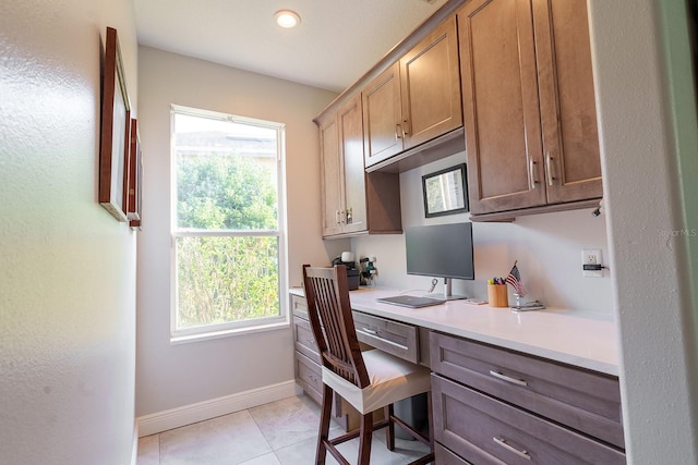 office area featuring built in study area, baseboards, light tile patterned floors, and recessed lighting