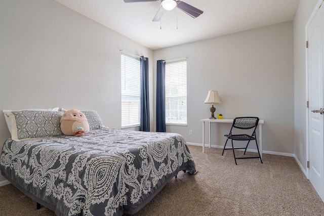 bedroom with carpet floors, ceiling fan, and baseboards