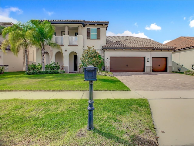 8491 Pippen Dr, Orlando, FL 32836 - mediterranean / spanish-style home featuring a balcony, decorative driveway, stucco siding, a garage, and a tile roof