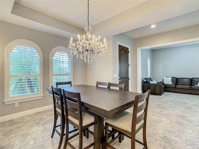 8491 Pippen Dr, Orlando, FL 32836 - dining space with baseboards and a chandelier