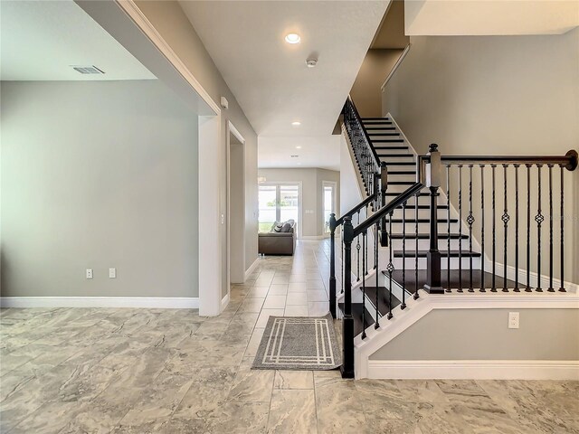 8491 Pippen Dr, Orlando, FL 32836 - stairs with baseboards and recessed lighting