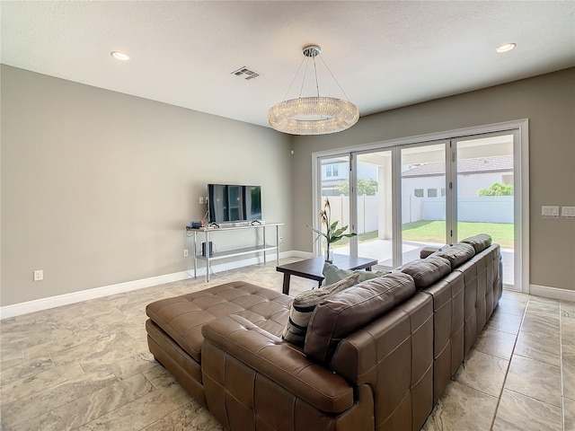 8491 Pippen Dr, Orlando, FL 32836 - living area featuring baseboards, light stone finish floors, and recessed lighting