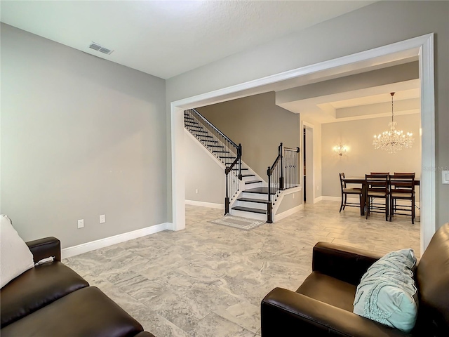 8491 Pippen Dr, Orlando, FL 32836 - living room with stairway, a chandelier, baseboards, and a tray ceiling