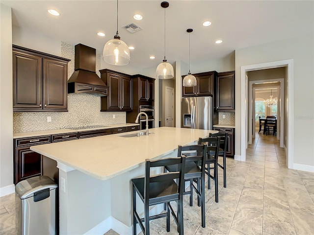 8491 Pippen Dr, Orlando, FL 32836 - kitchen with premium range hood, a sink, stainless steel refrigerator with ice dispenser, tasteful backsplash, and dark brown cabinets