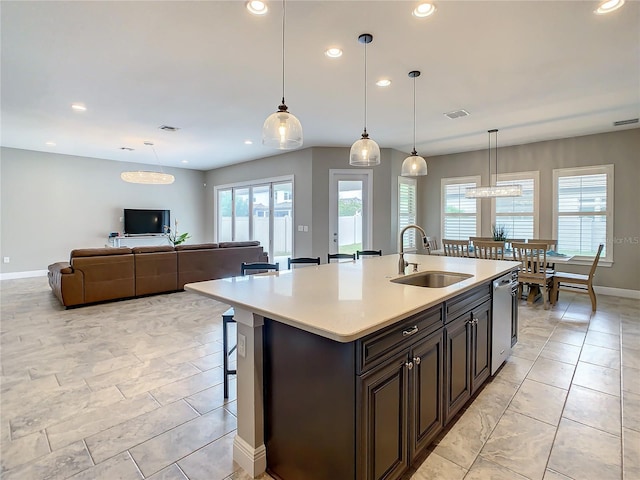 8491 Pippen Dr, Orlando, FL 32836 - kitchen featuring a sink, recessed lighting, light countertops, baseboards, and dishwasher